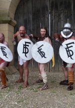 4 Gladiators with swords and shields ready for battle in front of the West Gate