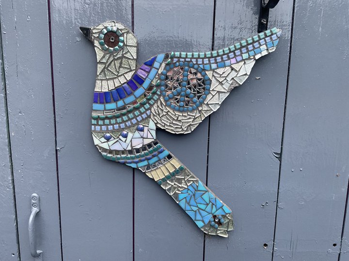 A decorative bird made of mosaic pieces