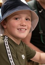 boy smiling at museum event 