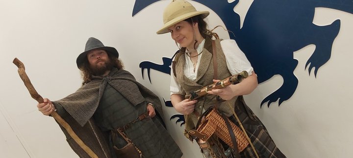 Two people are dressed as explorers