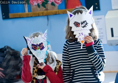two girls in wolf masks they made