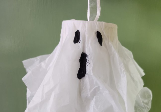 The face of a ghost crafted from white tissue 