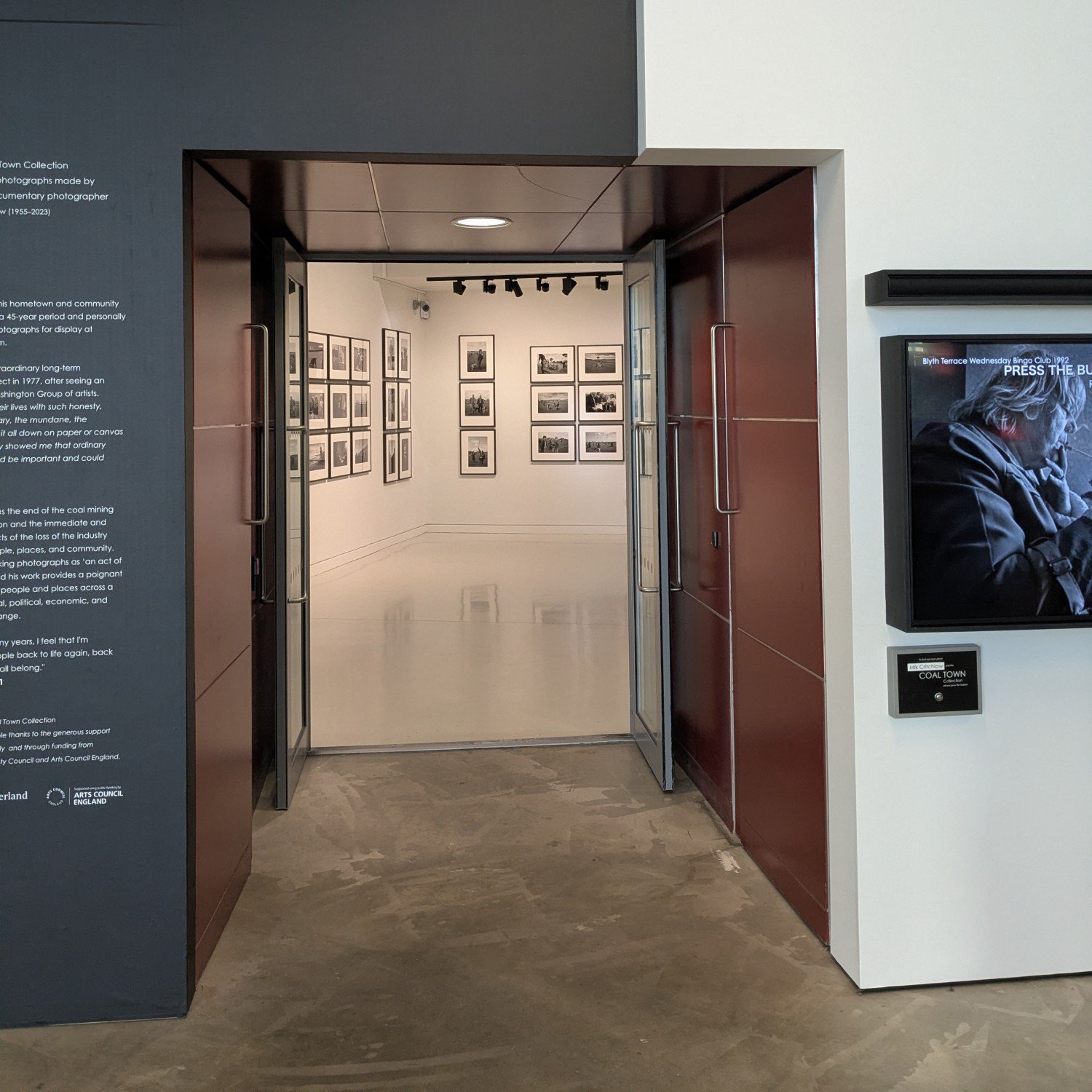 Looking into a photography exhibition at Woodhorn Museum.