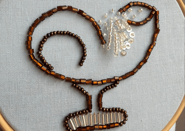 Embellished bead design on fabric