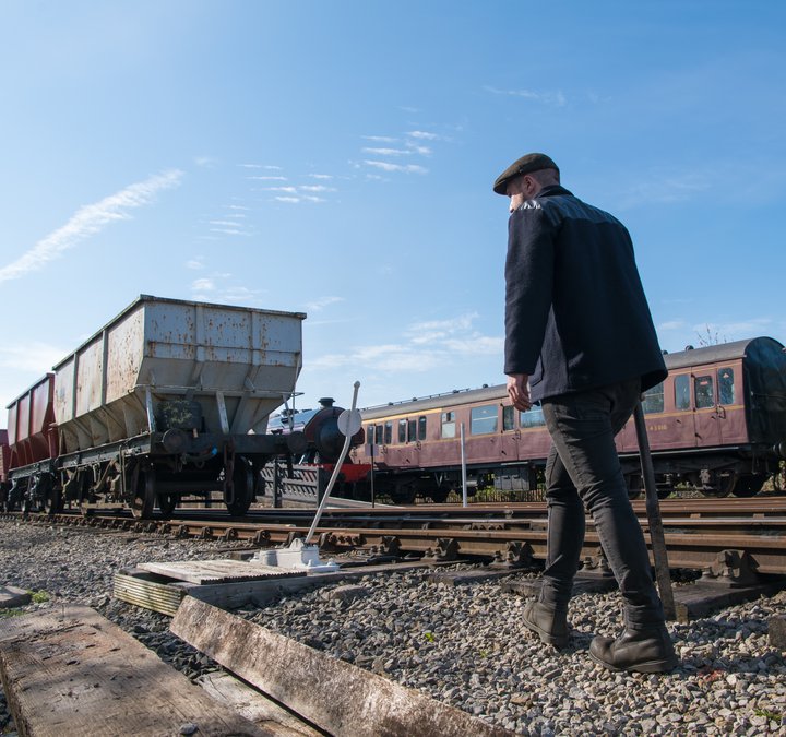 Person walking up the tracks at Stephenson Steam Railway