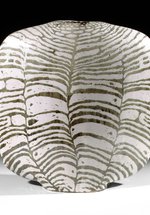 A black and white striped ceramic vessel