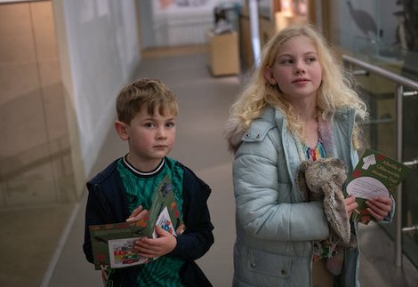 Two kids doing a museum trail