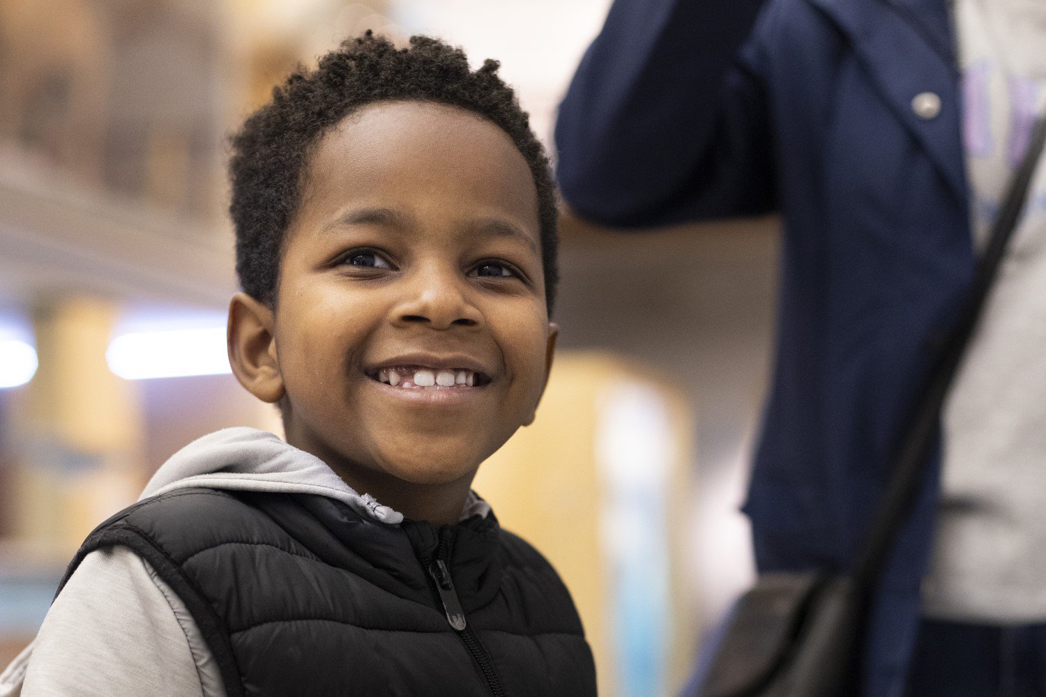 A head and shoulders close up of a boy smiling A head and shoulders close up of a boy smiling