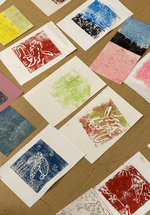 A photograph of a variety of prints made by children in fun, bright colours.