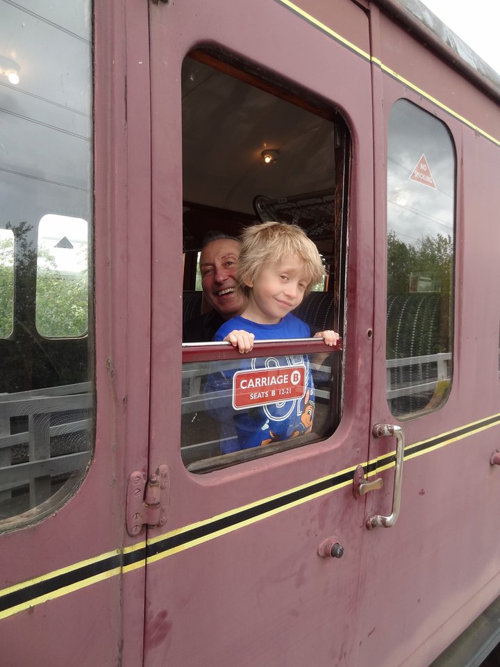 Man and boy at train carriage window