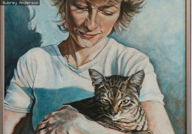 Woman cradling a cat