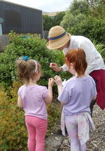 Children and adult in woodland walk area