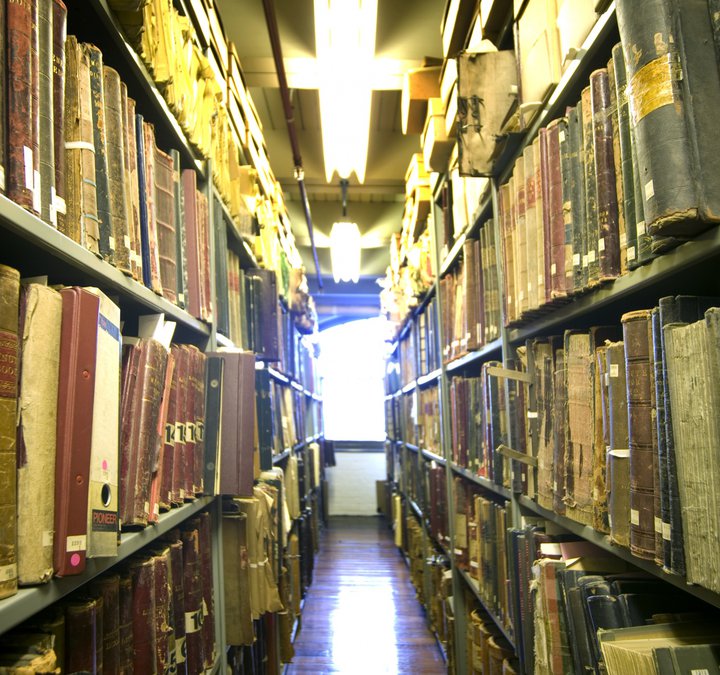 Books on shelves in the Archives