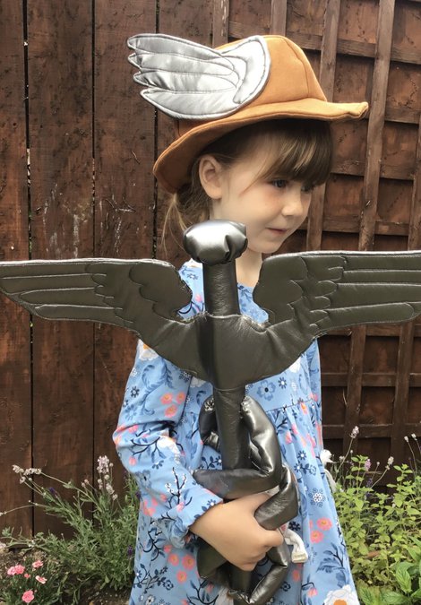 Girl wearing Mercury's staff and crown