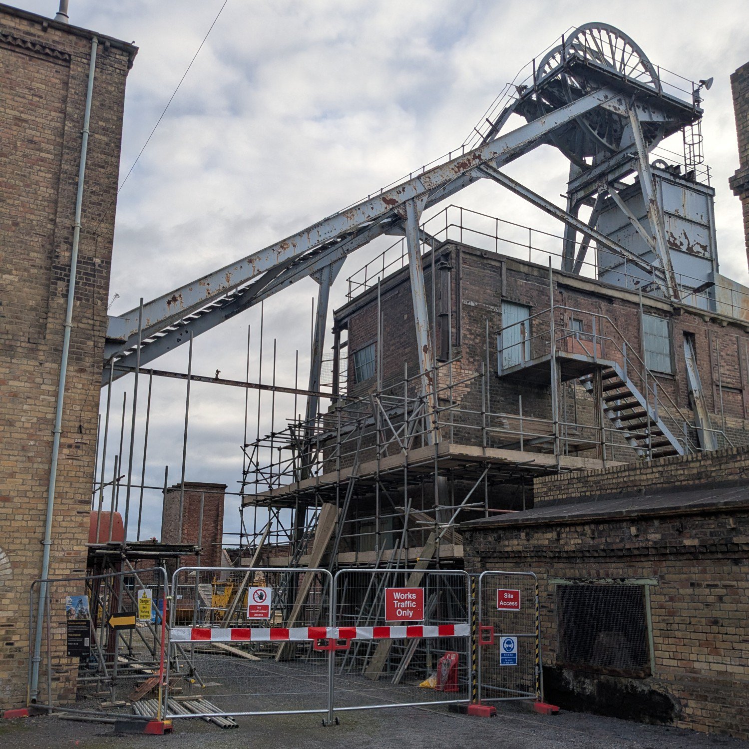 Building works happening underneath a steel colliery machine.
