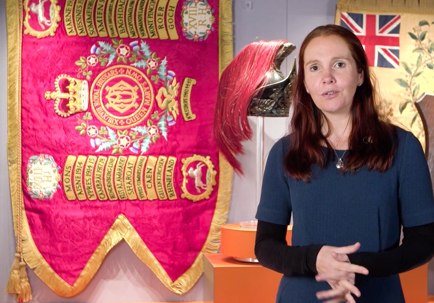 Curator with military flag