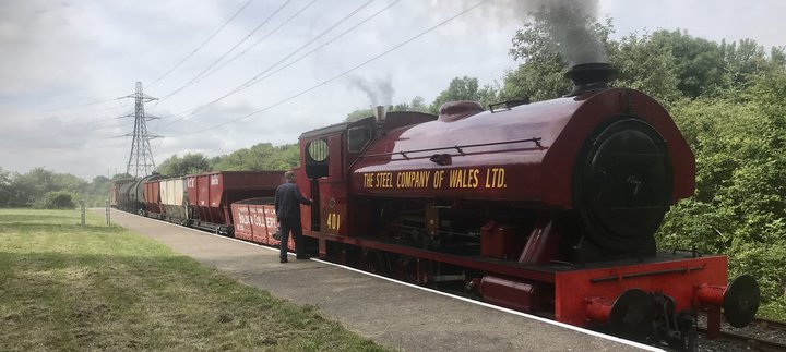 Steam locomotive pulling coal waggons