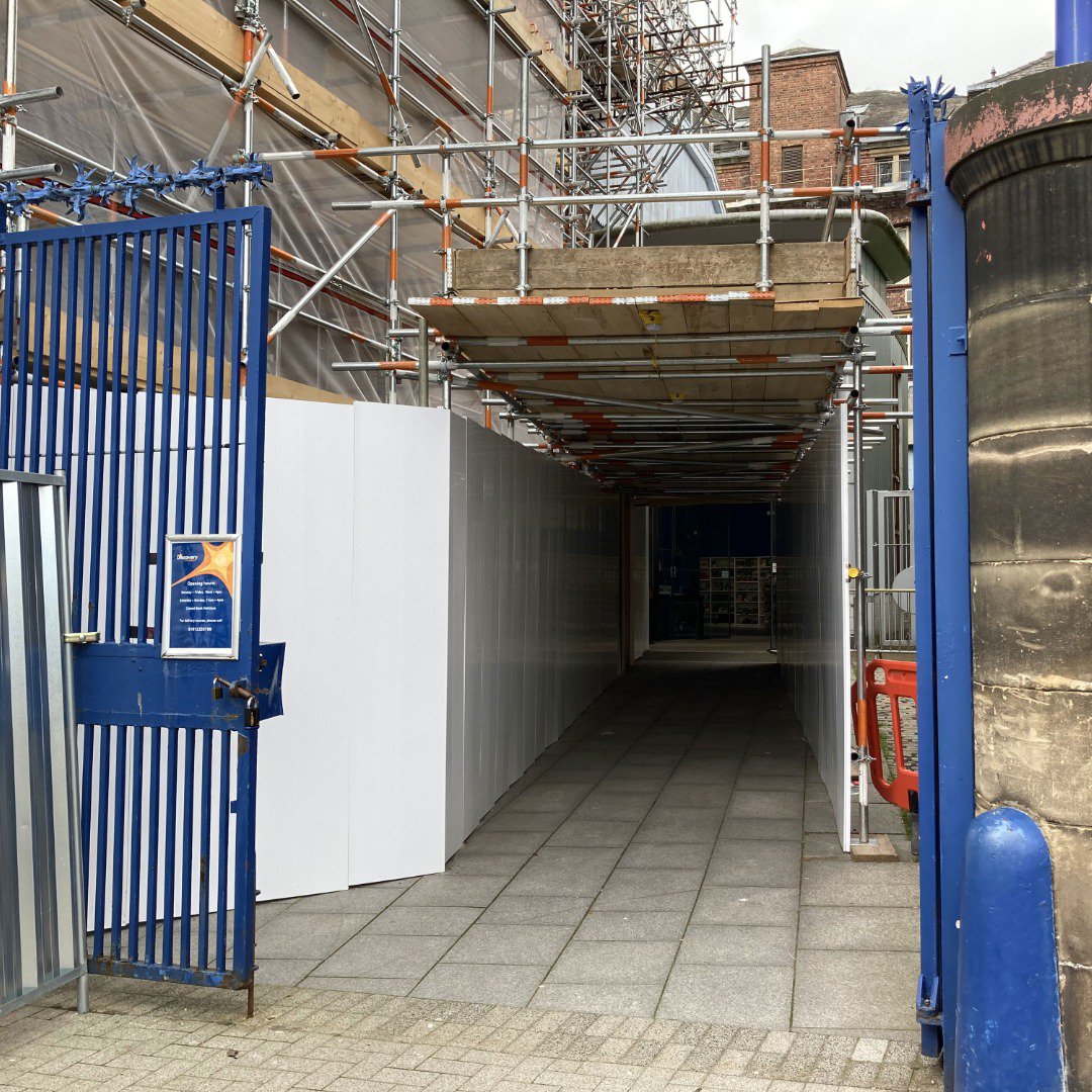 Tunnel made of scaffolding leading to museum entrance Tunnel made of scaffolding leading to museum entrance