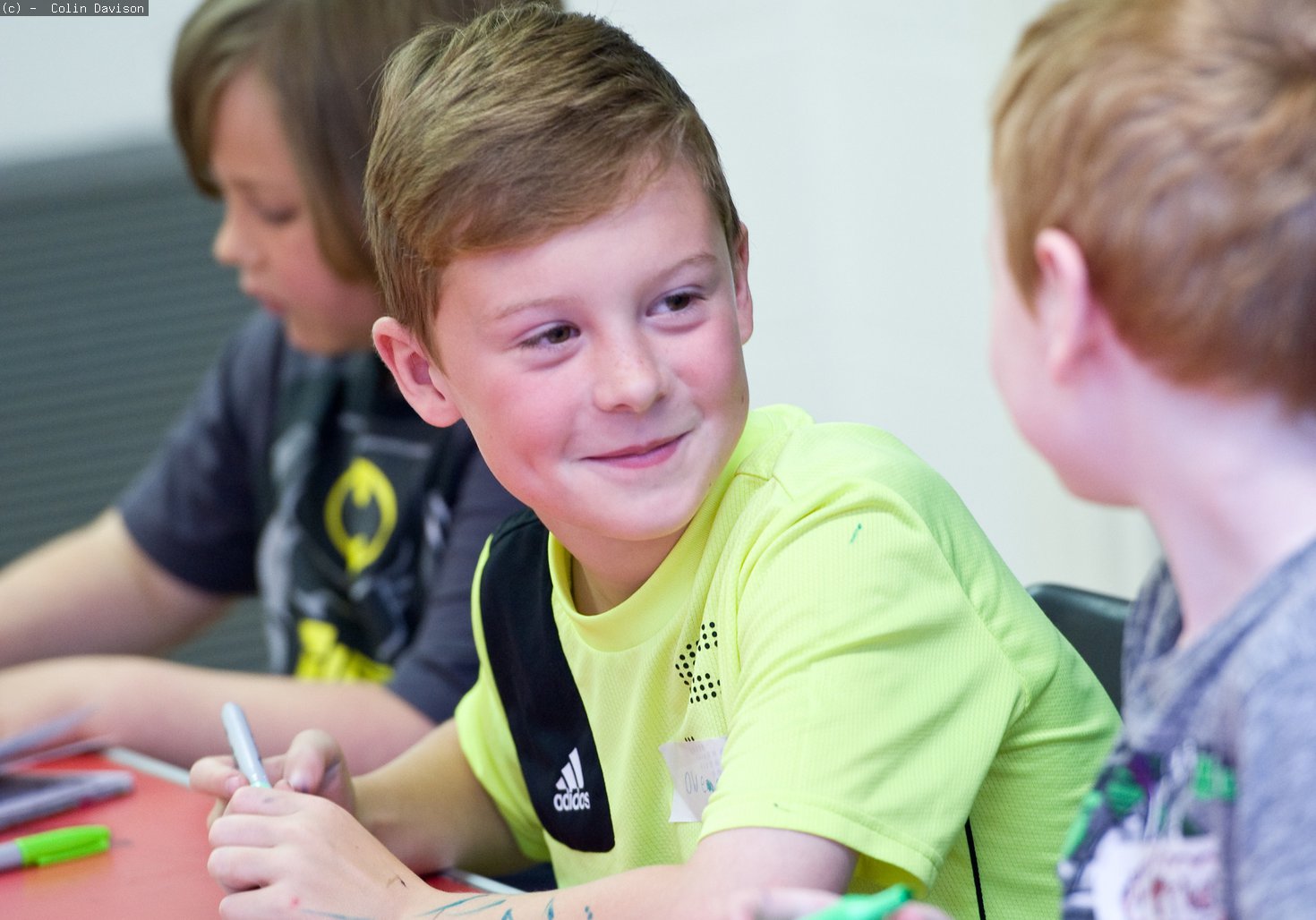 Two boys talking at an art academy day