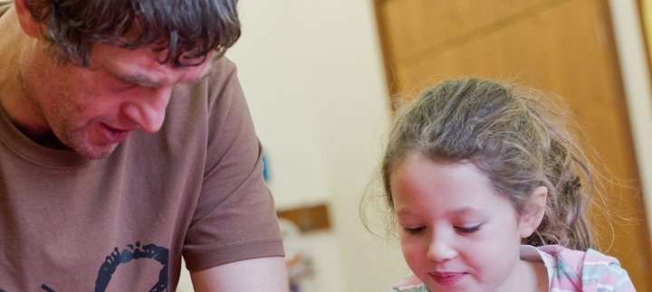 Dad and daughter engage in craft activity