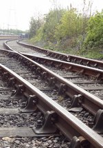 Railway tracks stretching towards the platform