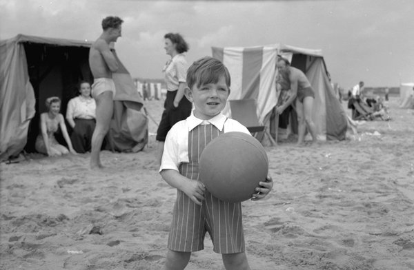 a boy with a ball at the beach, South Shields, August 1950. a boy with a ball at the beach, South Shields, August 1950.