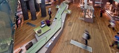 Aerial view of visitors walking around a large 3D model of Hadrian's Wall