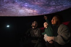 A family in a planetarium 