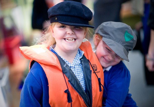 Young female student wears a historical cap 