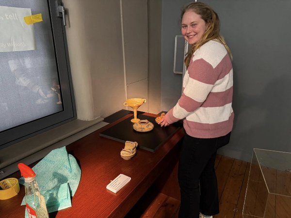 Emily arranging the artefacts for the exhibition Emily arranging the artefacts for the exhibition