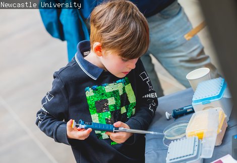 A child is doing a science activity