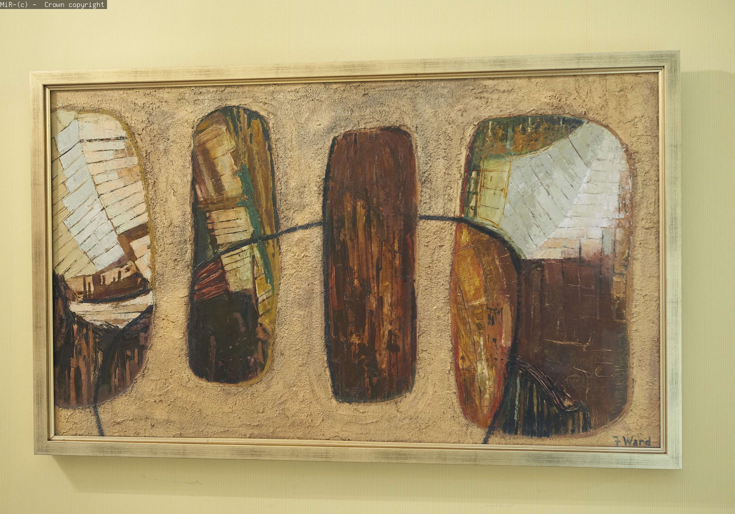 An abstract painting in earth colours on display. 