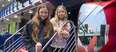 Two girls at RAF simulator ride 
