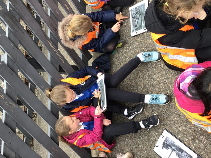 Children looking at a Woodland Walk Search at Stephenson Steam Railway