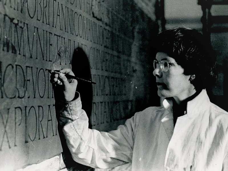 Mary Hurrell painting a Roman inscription from Risingham Roman fort in the former Museum of Antiquities