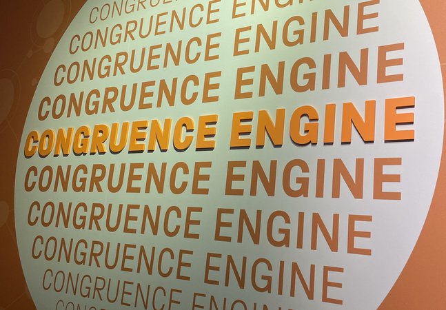 Orange wall with text: The Congruence Engine 