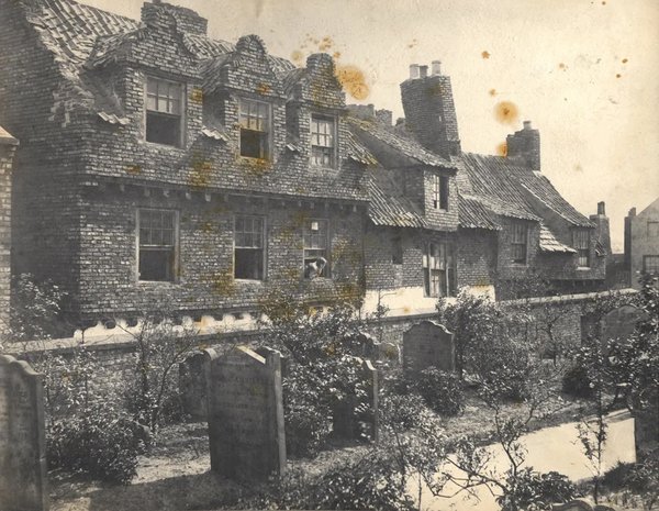 Church Lane Newcastle upon Tyne 1884. The photograph shows Church Lane and the rear of properties on Dog Bank as seen from All Saints Churchyard. 