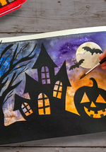 A watercolour painting of a house, tree and pumpkin with an orange and purple background.