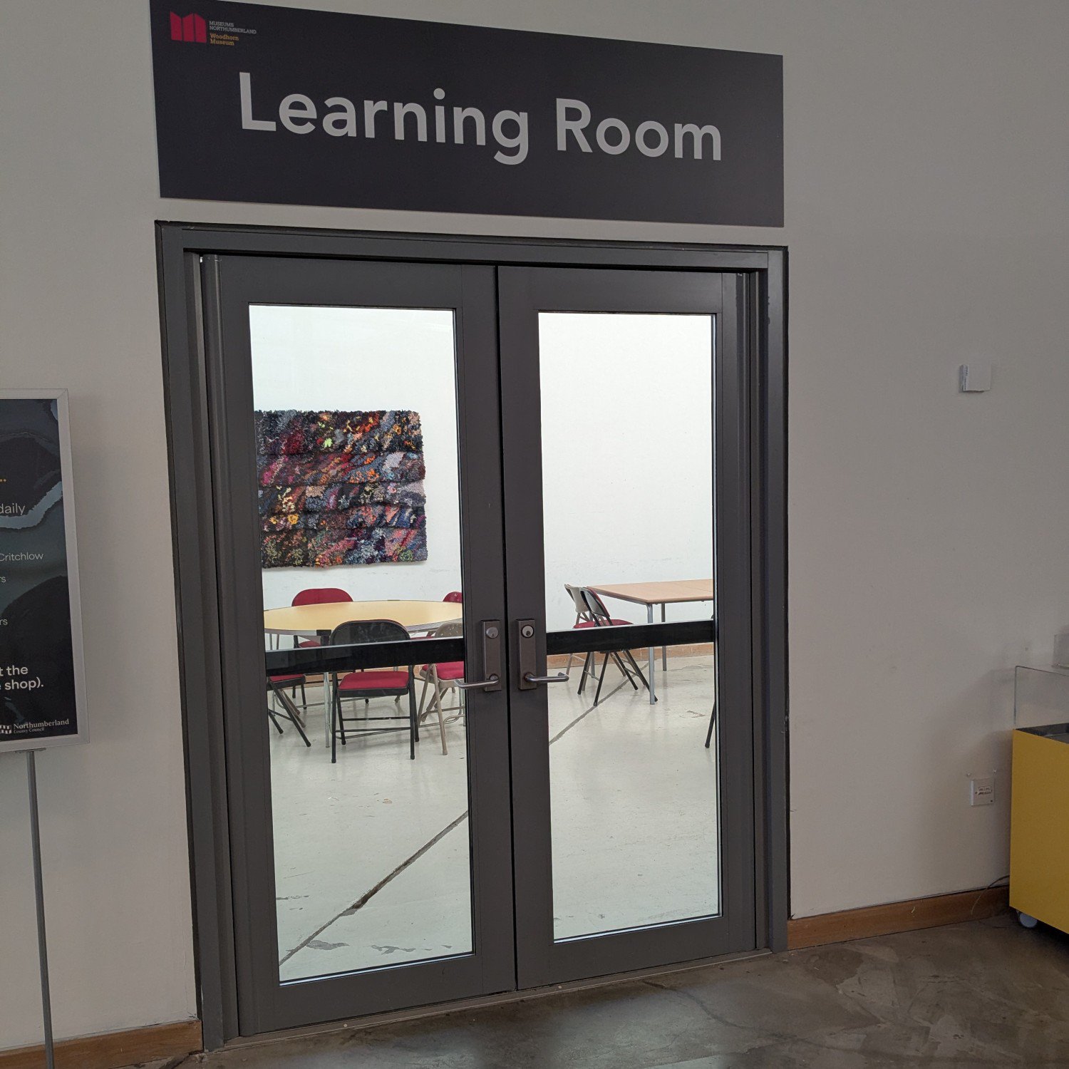 The glass doors of a classroom in Woodhorn Museum.