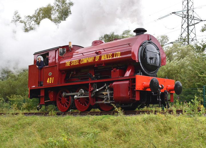 Red steam locomotive on railway track