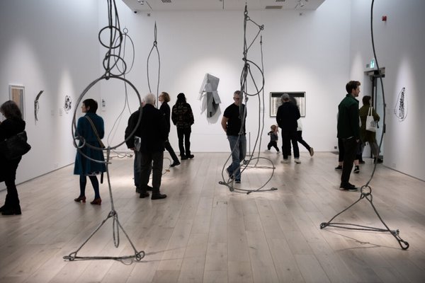 People walking around gallery