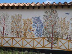 Paintings of flowers, trees and birds on wall 