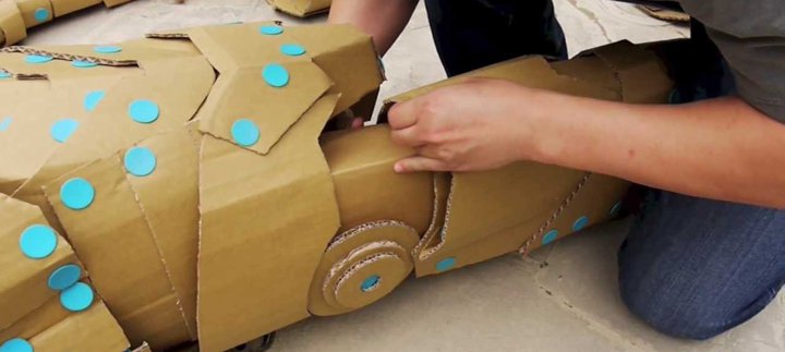 Recycled cardboard being constructed into a vehicle