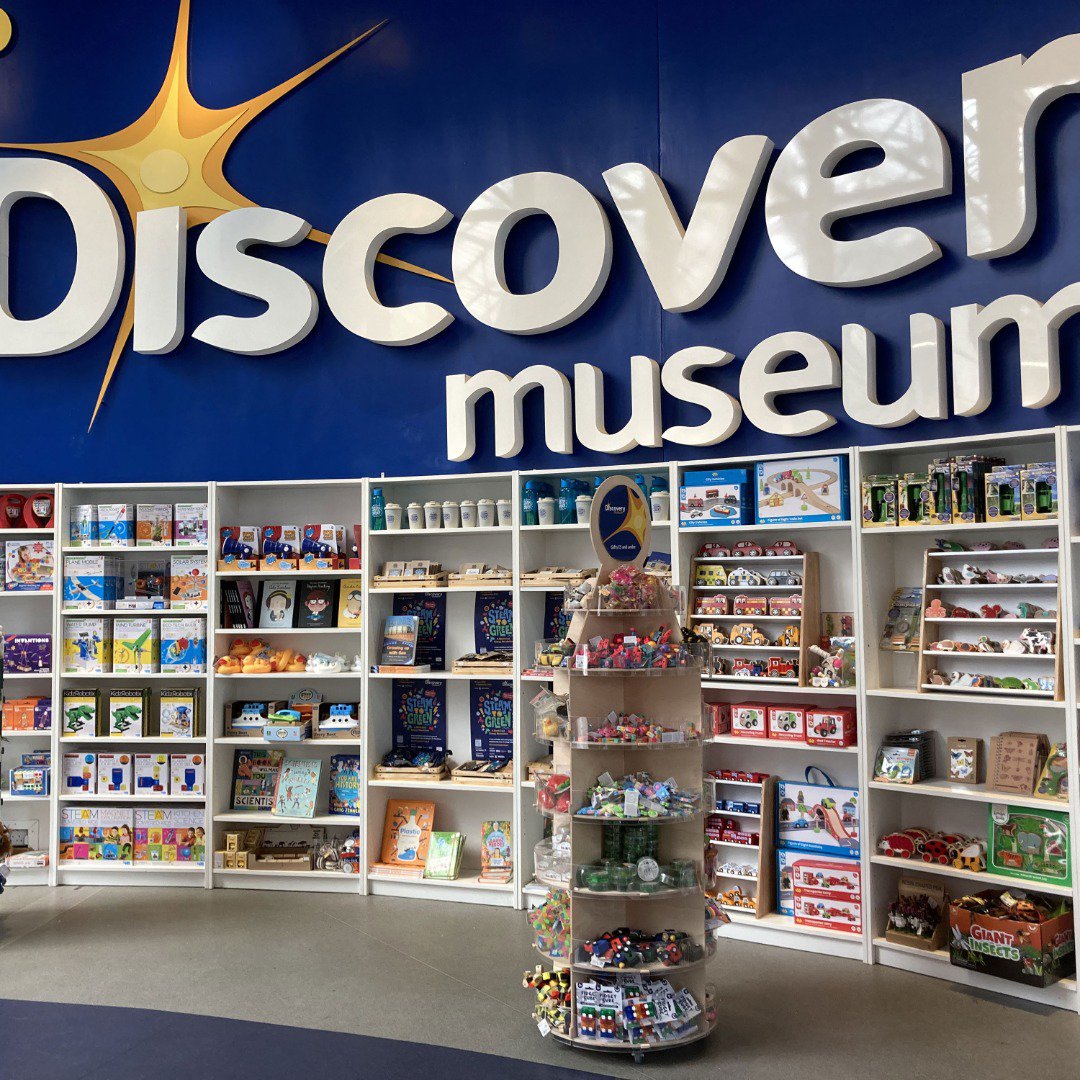 Museum shop products on shelving Museum shop products on shelving