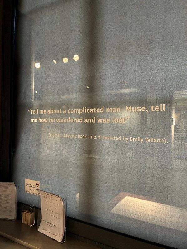 The first line of the Odyssey, translated by Emily Wilson, on display on the window The first line of the Odyssey, translated by Emily Wilson, on display on the window