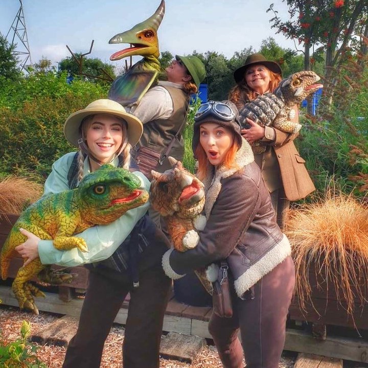 Puppeteers with dinosaurs puppets