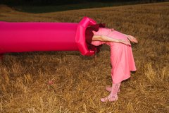 A person leans into a inflatable tube