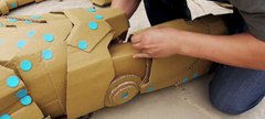 Recycled cardboard being constructed into a vehicle