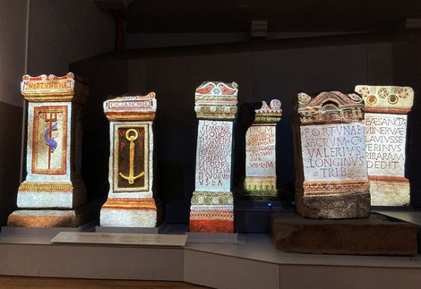 Roman alters with colourful animations projected onto their surface