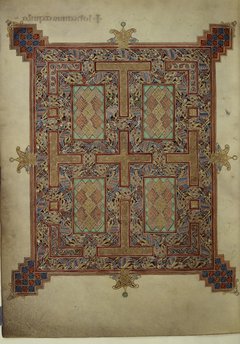 Photo: carpet page from the Lindisfarne Gospels. It is a highly detailed page with a cross pattern embedded in its design.